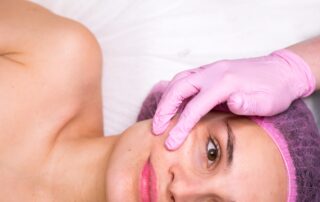 Portrait of a woman getting anti-aging facial massage
